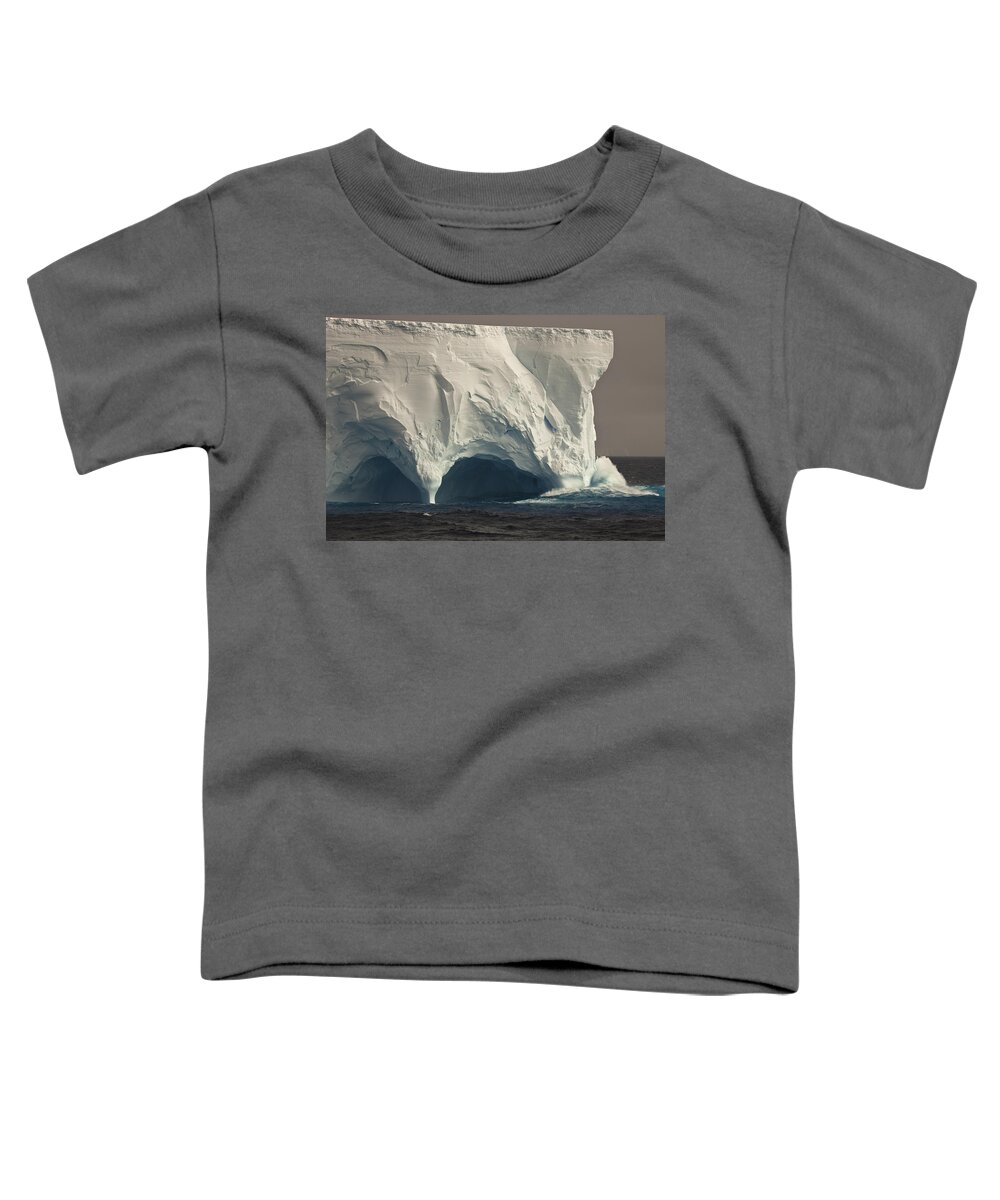 00427971 Toddler T-Shirt featuring the photograph Wave Crashing Into Eroded Tunnel by Colin Monteath