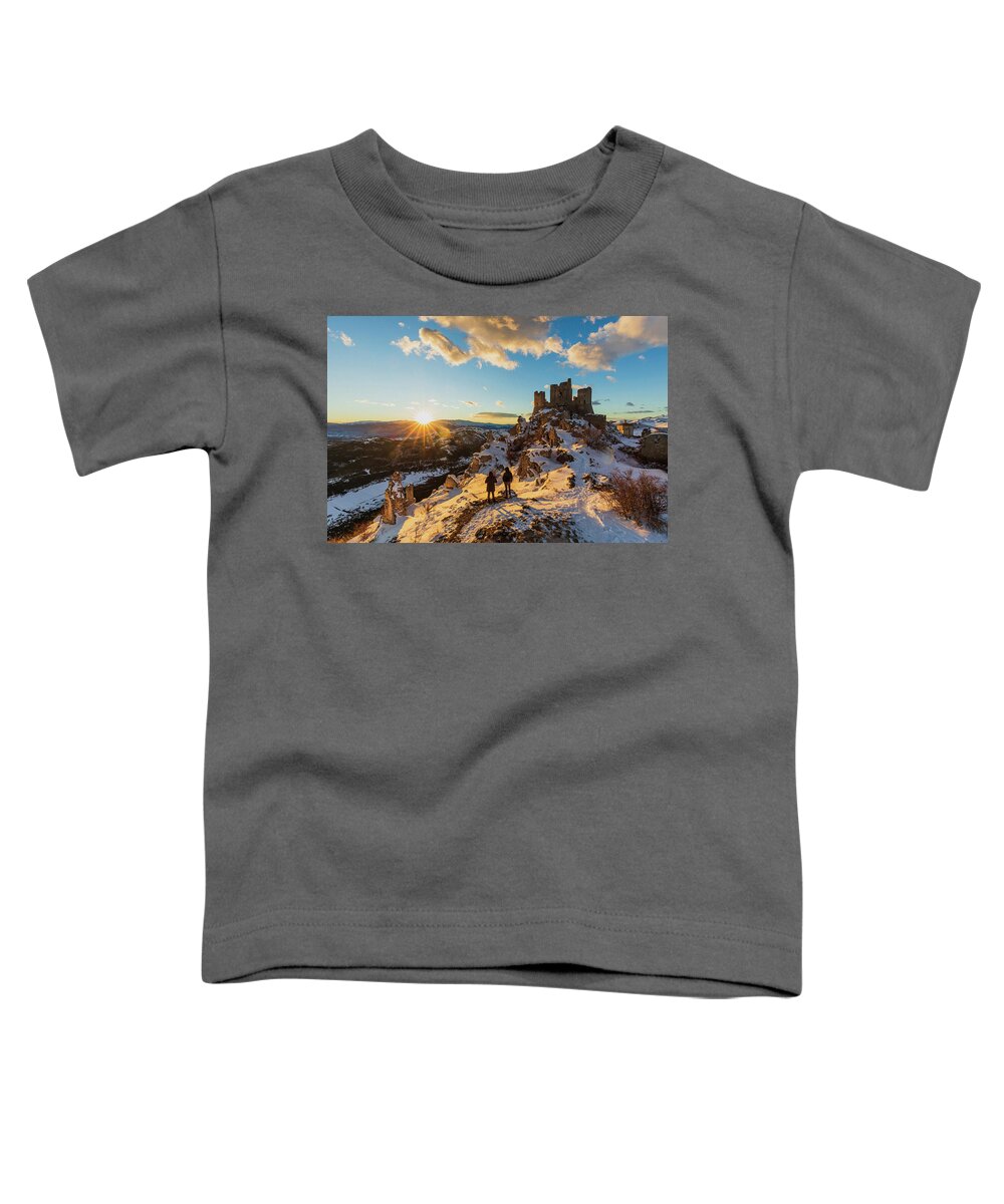 Estock Toddler T-Shirt featuring the digital art Italy, Abruzzo, L'aquila District, Gran Sasso National Park, Calascio, Medieval Castle Or Rocca Calascio At Sunset On A Winter Evening With The Hill Full Of Snow #4 by Maurizio Rellini