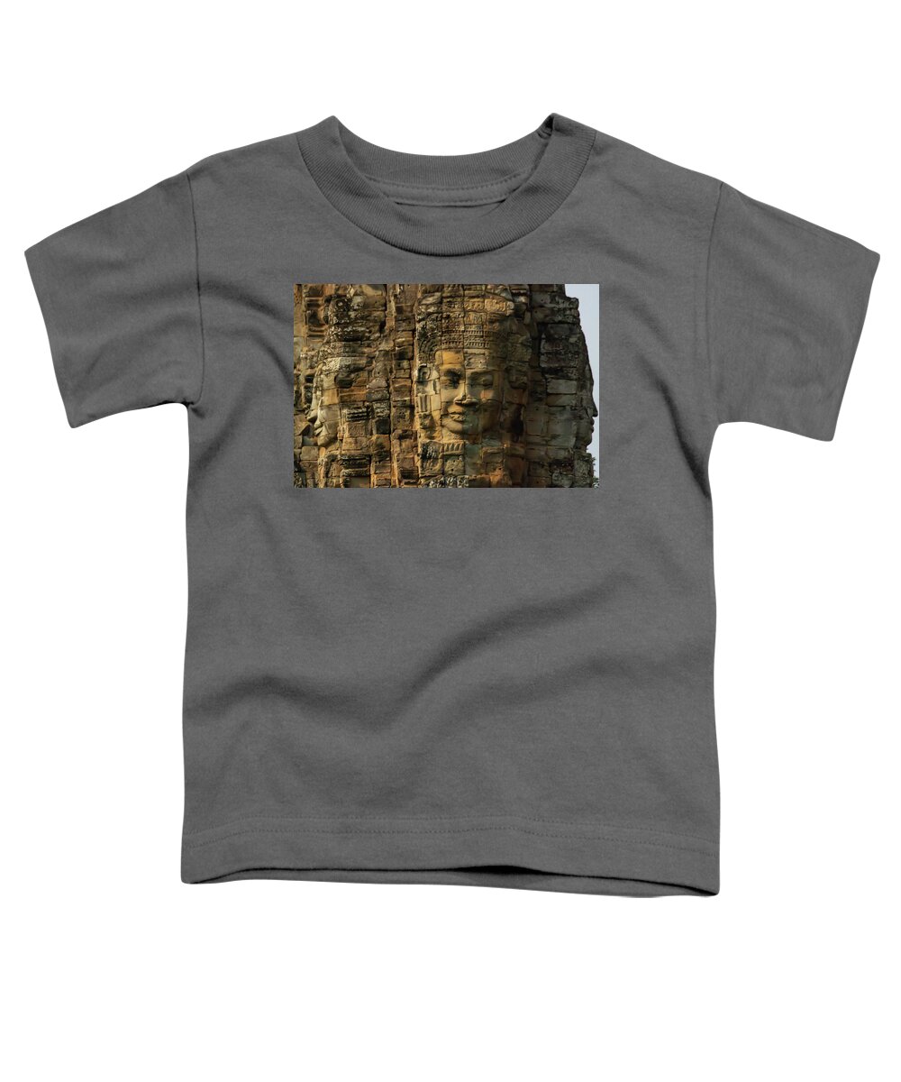 Ancient Toddler T-Shirt featuring the photograph Close up of faces on towers at Bayon Temple in Angkor Tom, Siem by Karen Foley