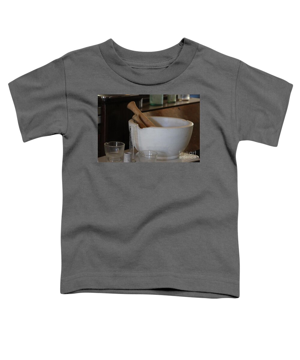 Apothecary Toddler T-Shirt featuring the photograph Pestle and Mortar at Fort Stanton New Mexico by Colleen Cornelius