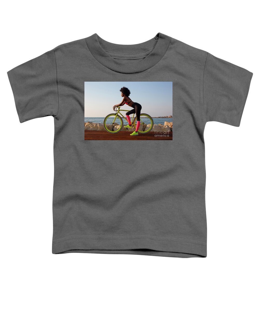 Young Toddler T-Shirt featuring the photograph Young athletic woman with bicycle k2 by Ami Siano