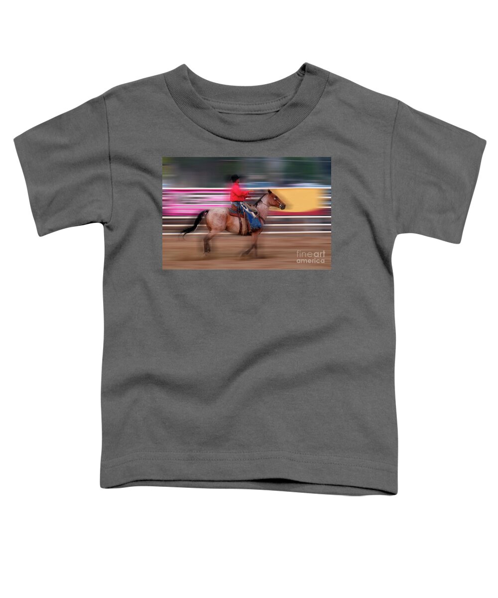 America Toddler T-Shirt featuring the photograph Cowboy Riding Horse Fast blurry Speed #1 by Lane Erickson