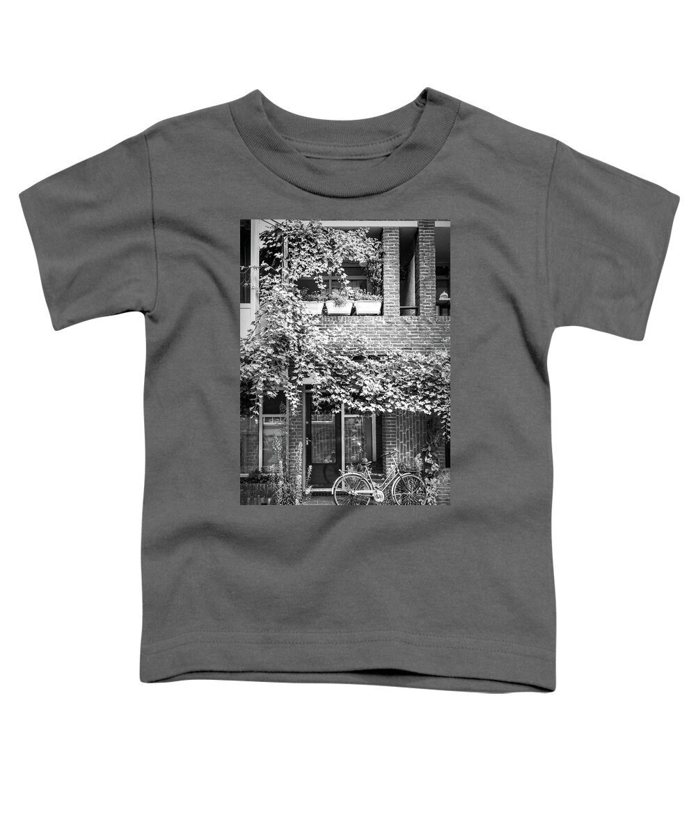 Spring Toddler T-Shirt featuring the photograph Bicycle Along the Streets of Amsterdam in Black and White by Debra and Dave Vanderlaan