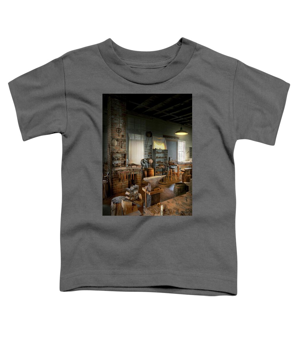 Blacksmith Toddler T-Shirt featuring the photograph Blacksmith - The creative art of blacksmithing by Mike Savad