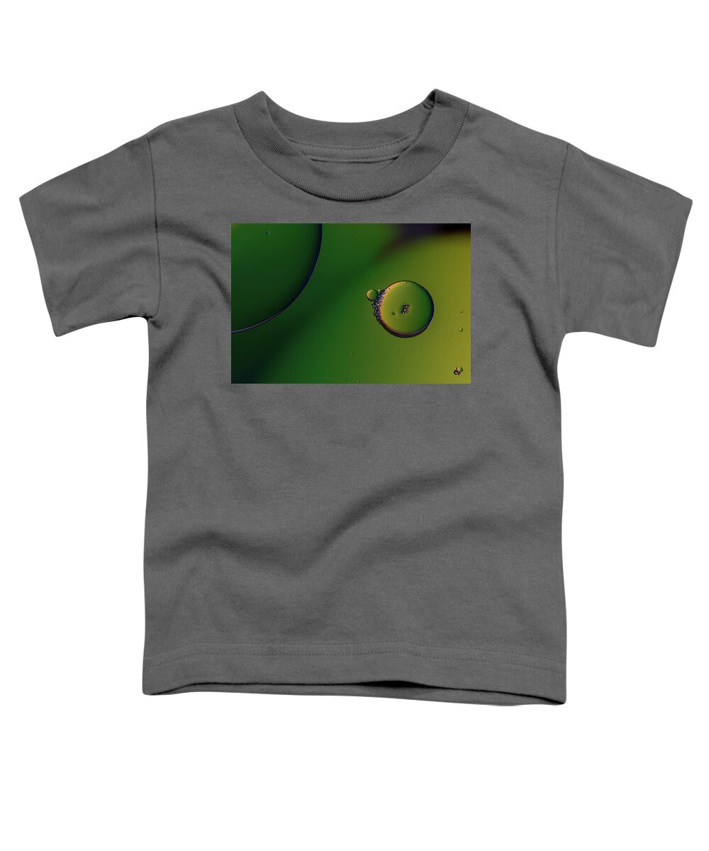 Connection Toddler T-Shirt featuring the photograph Bright abstract, green background with flying bubbles by Michalakis Ppalis