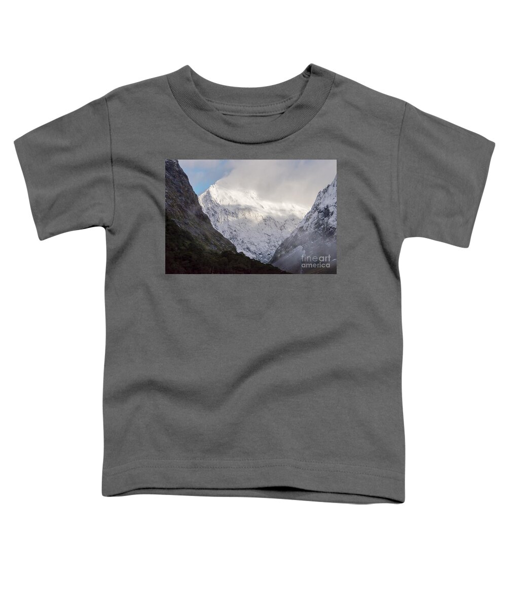 Milford Sound Toddler T-Shirt featuring the photograph Clouds and Snow around Milford Sound One by Bob Phillips