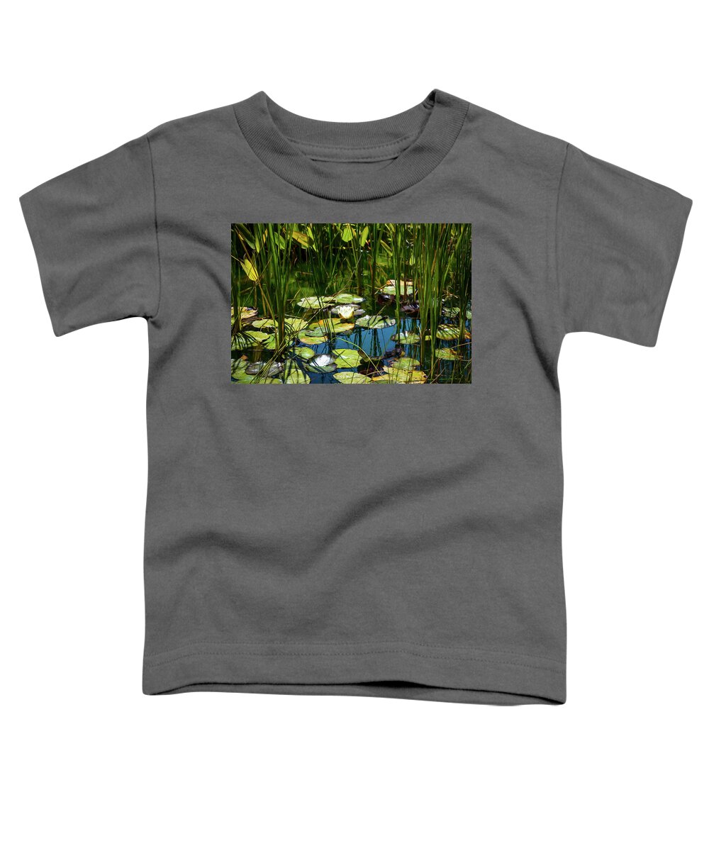 Water Lily Toddler T-Shirt featuring the photograph Deep in the Lily Pond by Bonnie Follett