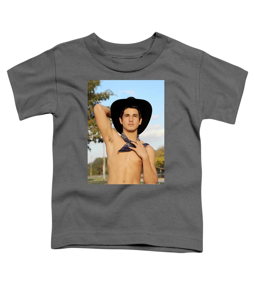 Body Toddler T-Shirt featuring the photograph Handsome hispanic cowboy is wearing a black cowboy hat by Gunther Allen