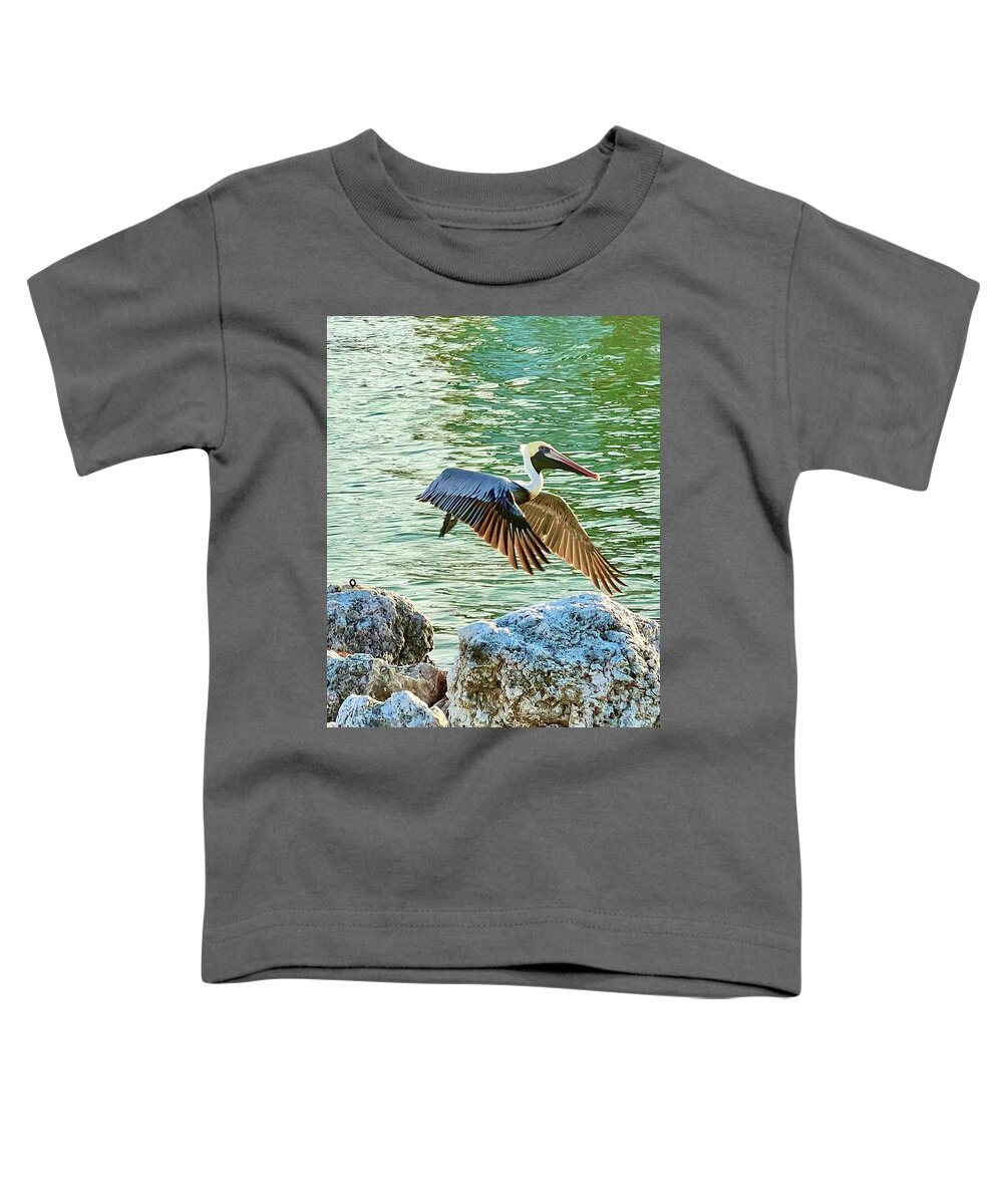 Pelican Toddler T-Shirt featuring the photograph Light Wing Flight by Kelly Smith