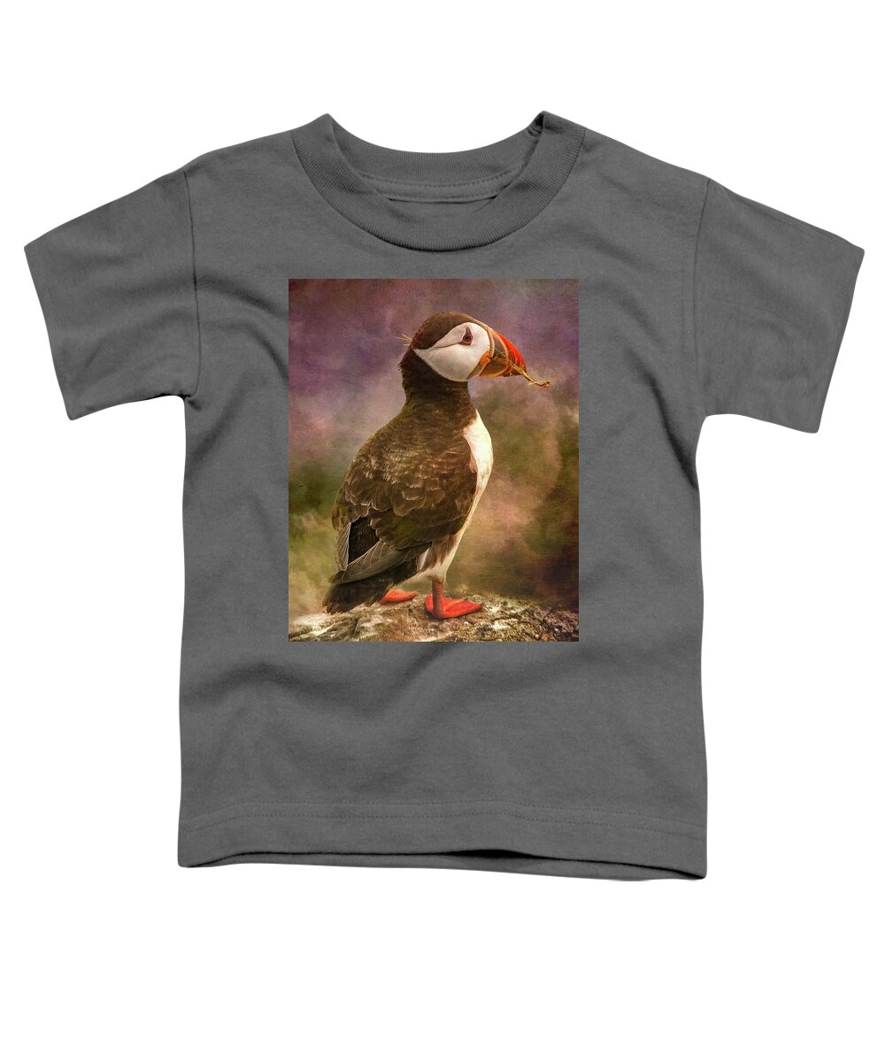 25-31 March 2010 Toddler T-Shirt featuring the photograph Puffin with nesting twig in mouth by Sue Leonard
