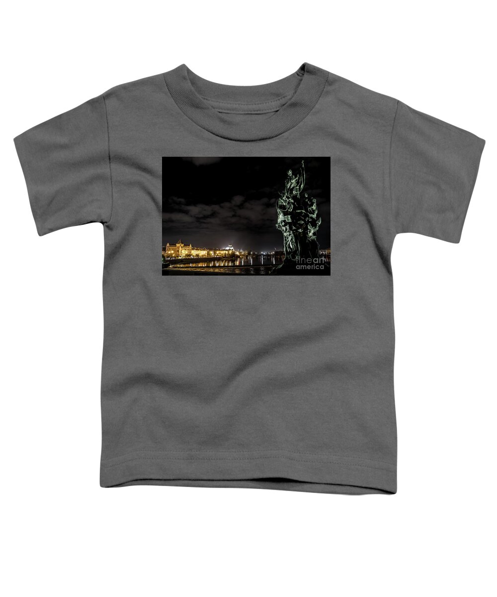 Ancient Toddler T-Shirt featuring the photograph Statue On Charles Bridge And Illuminated Buildings In Prague In The Czech Republic by Andreas Berthold
