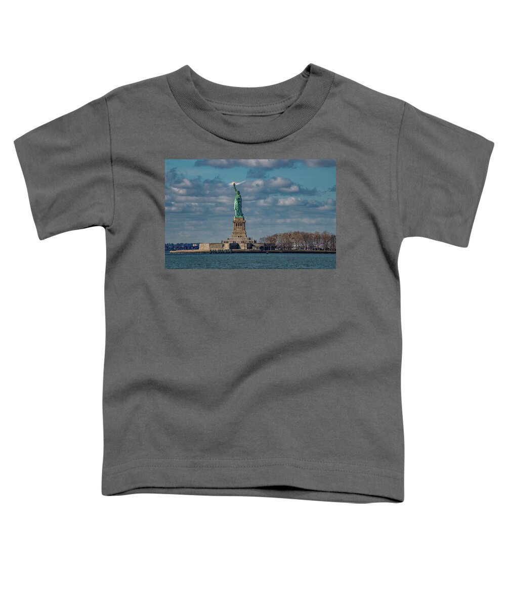 Nyc Toddler T-Shirt featuring the photograph Still She Stands Shining In The Harbor by Marcy Wielfaert