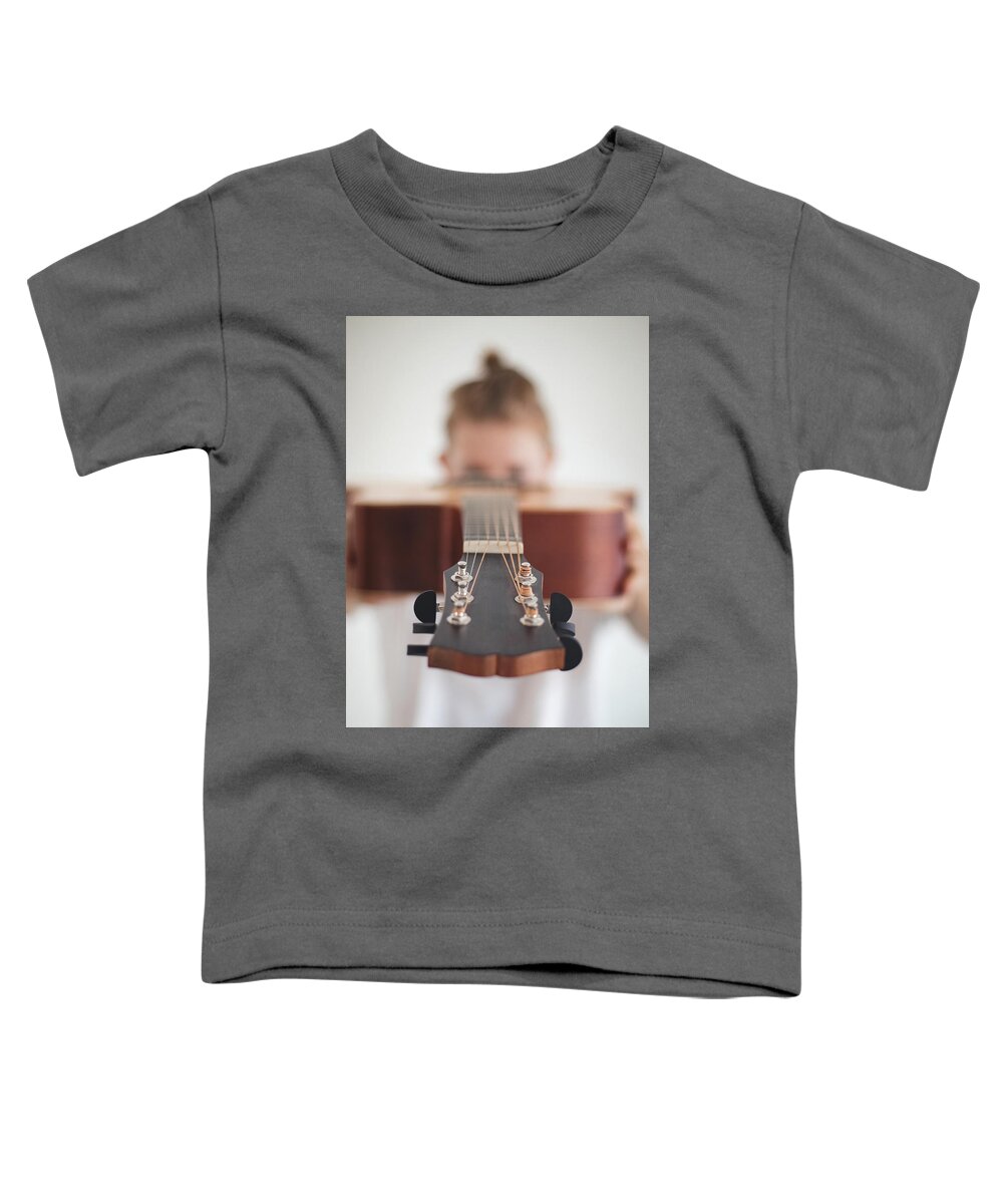 Excited Toddler T-Shirt featuring the photograph Wooden guitar head by Vaclav Sonnek
