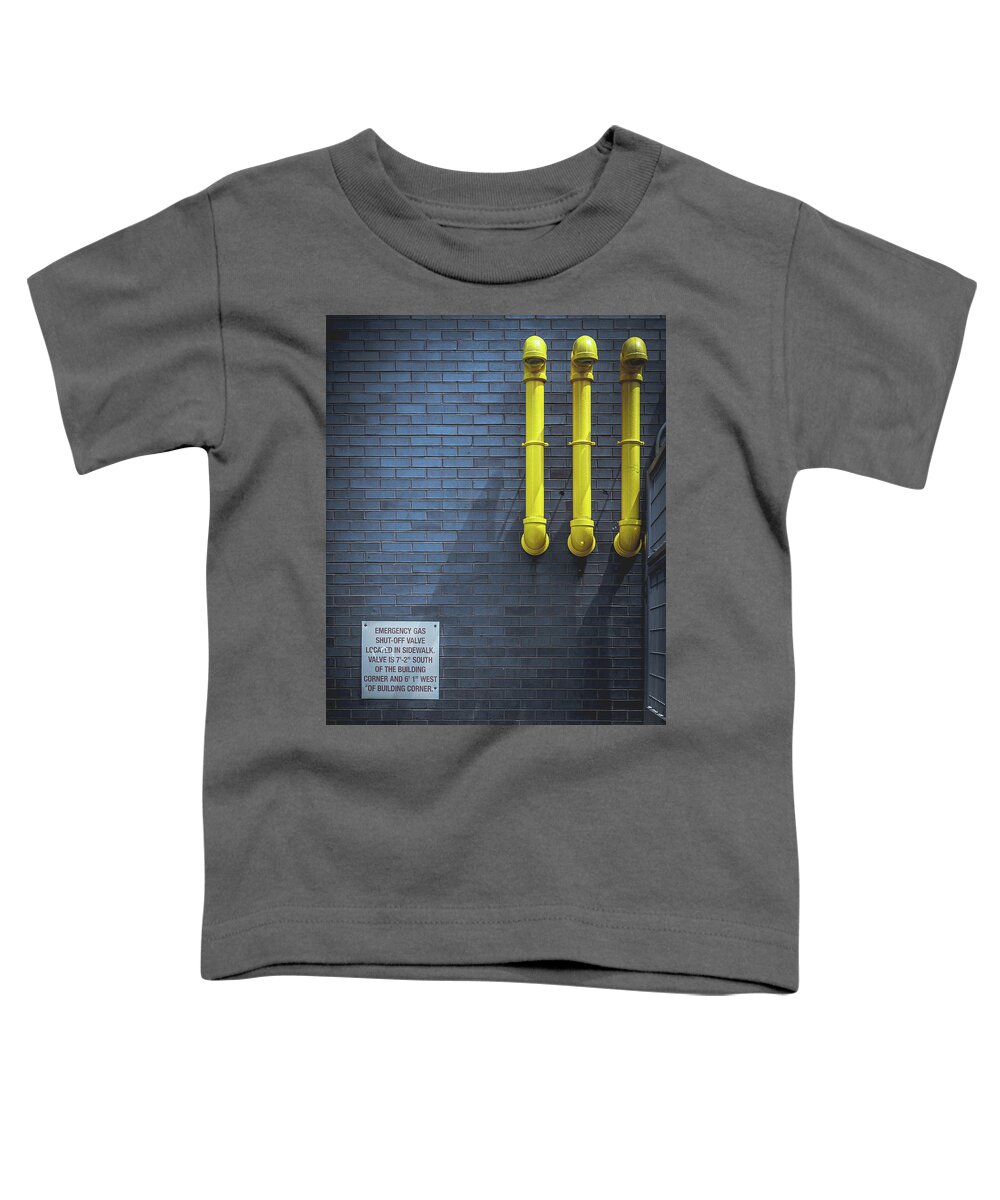 Yellow Pipes Toddler T-Shirt featuring the photograph yellow pipes - Queens, NY by Steve Stanger