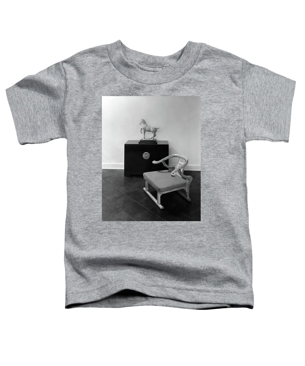 Home Toddler T-Shirt featuring the photograph A Chair, Bedside Cabinet And Sculpture Of A Horse by Haanel Cassidy