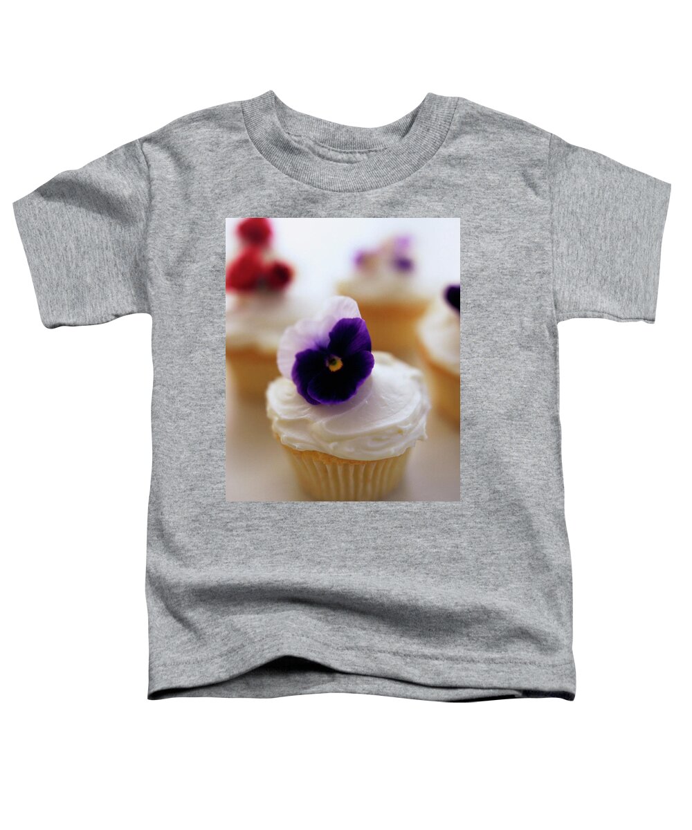 Bridal Toddler T-Shirt featuring the photograph A Cupcake With A Violet On Top by Romulo Yanes