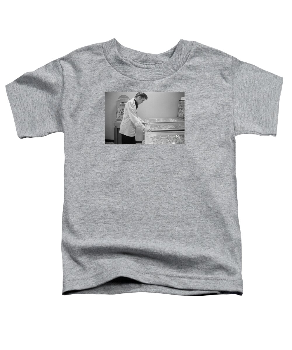 Elvis Toddler T-Shirt featuring the photograph Elvis Presley playing Pinball 1956 by The Harrington Collection