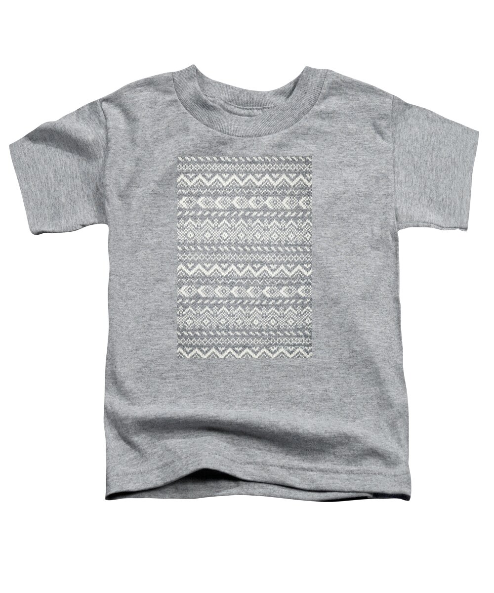 Knitted Toddler T-Shirt featuring the photograph Knit pattern abstract by Elena Elisseeva