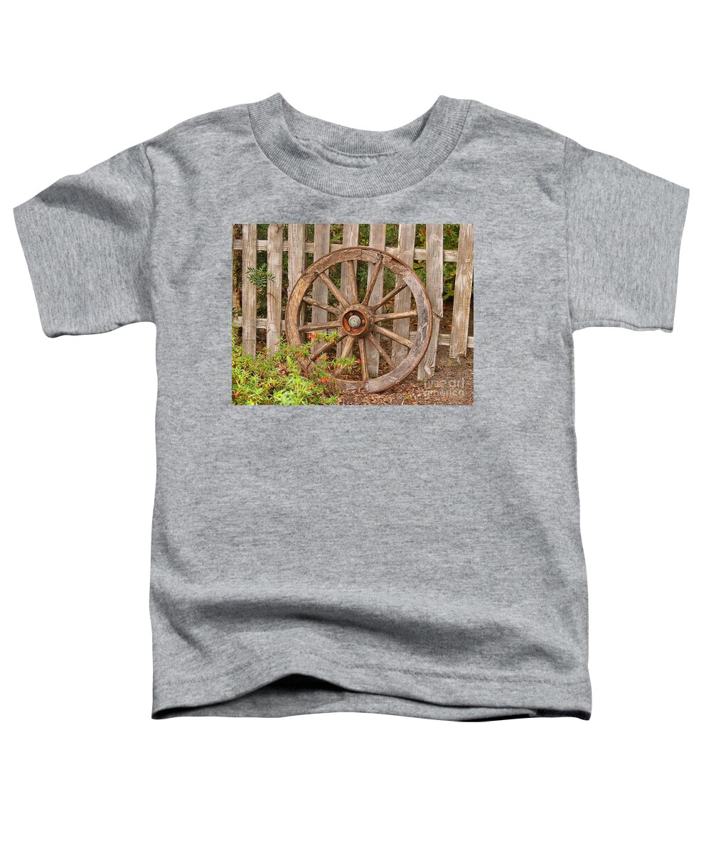 Wooden Wagon Wheel Toddler T-Shirt featuring the photograph Old Spare Wheel by Chris Thaxter