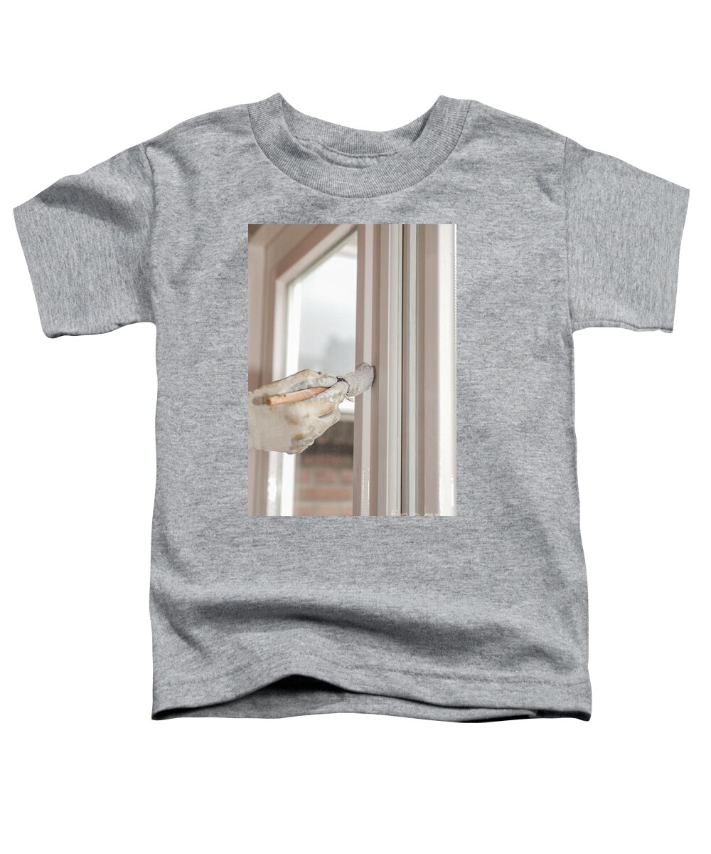 Brush Toddler T-Shirt featuring the photograph Painting a window with white by Patricia Hofmeester