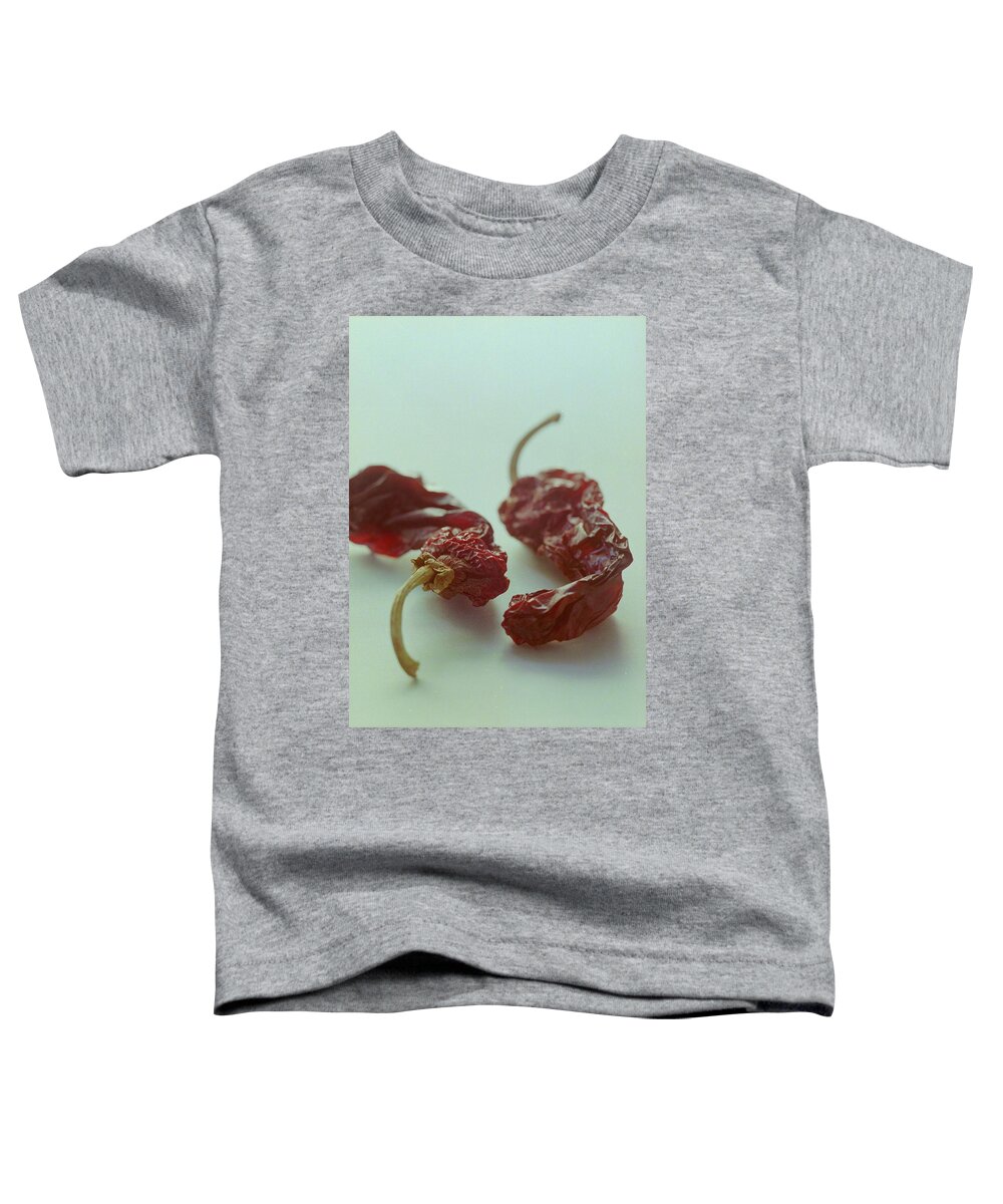 Nobody Toddler T-Shirt featuring the photograph Two Dried Peppers by Romulo Yanes