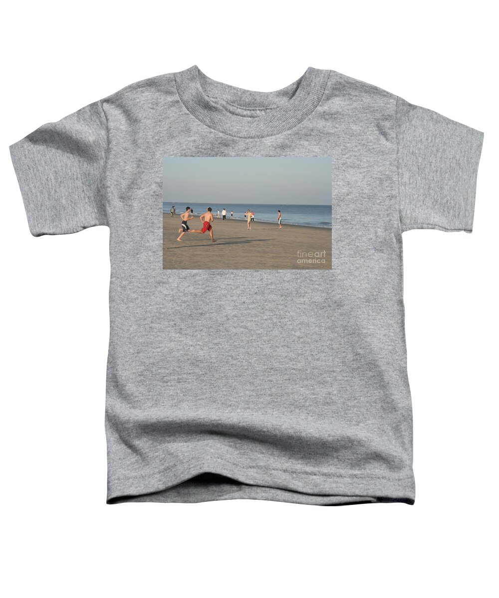 Barony Beach Club Toddler T-Shirt featuring the photograph Youth Playing on the Beach at Hilton Head South Carolina by Thomas Marchessault
