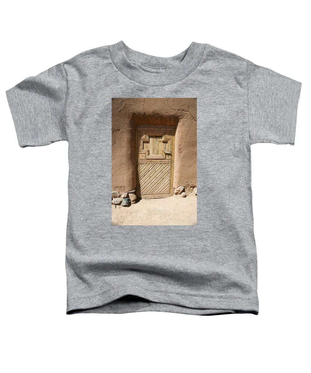 Santa Fe Toddler T-Shirt featuring the photograph Mission Door by Ron Weathers
