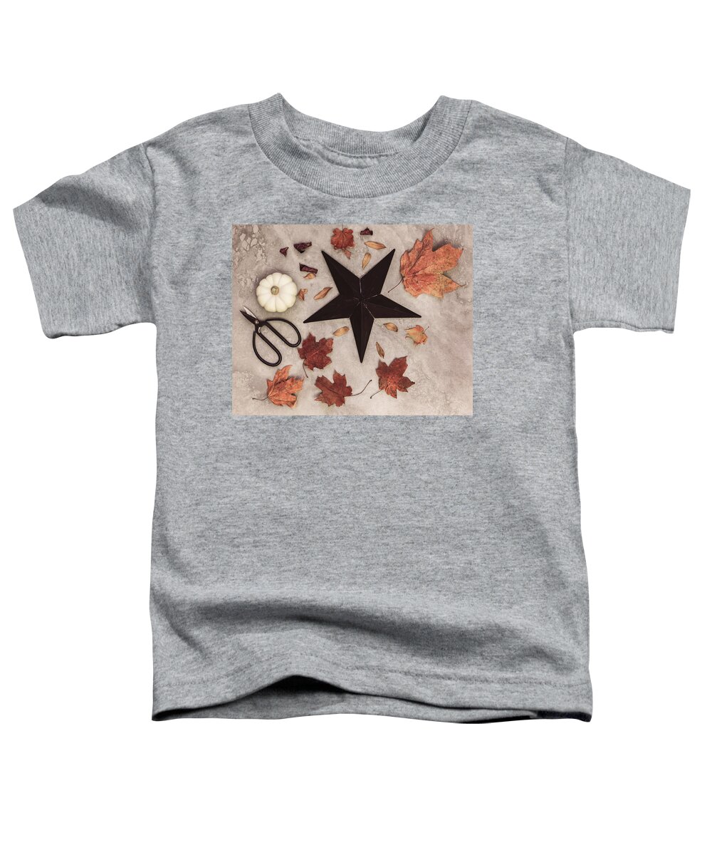 Star Toddler T-Shirt featuring the photograph A Star Among the Autumn Leaves by Kim Hojnacki