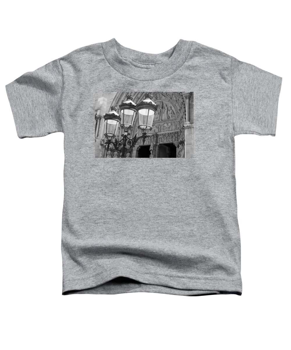Paris Toddler T-Shirt featuring the photograph Notre Dame Street Lights Paris France Black and White by Toby McGuire