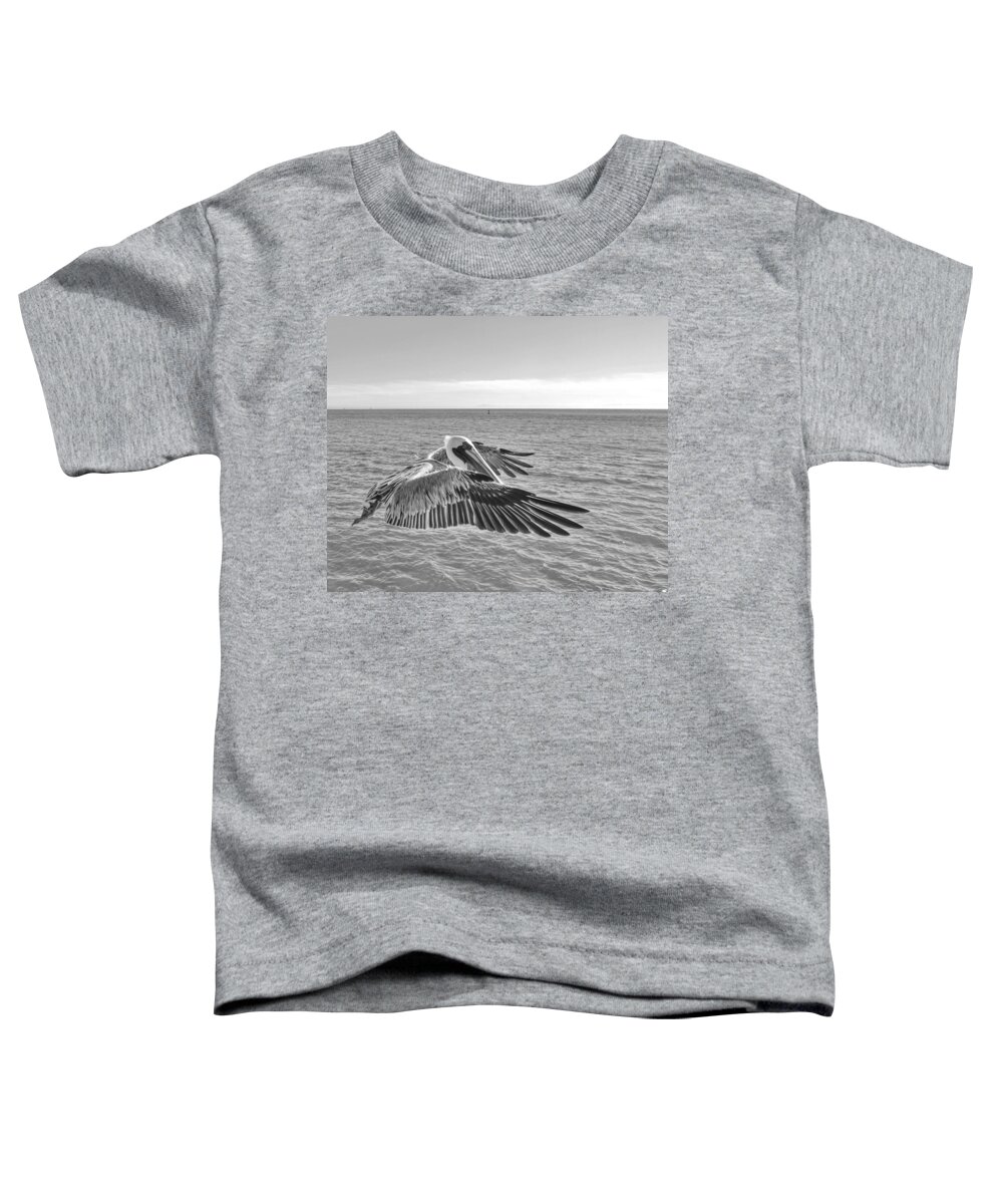 Birds Toddler T-Shirt featuring the photograph Pelican Flight by Doris Aguirre