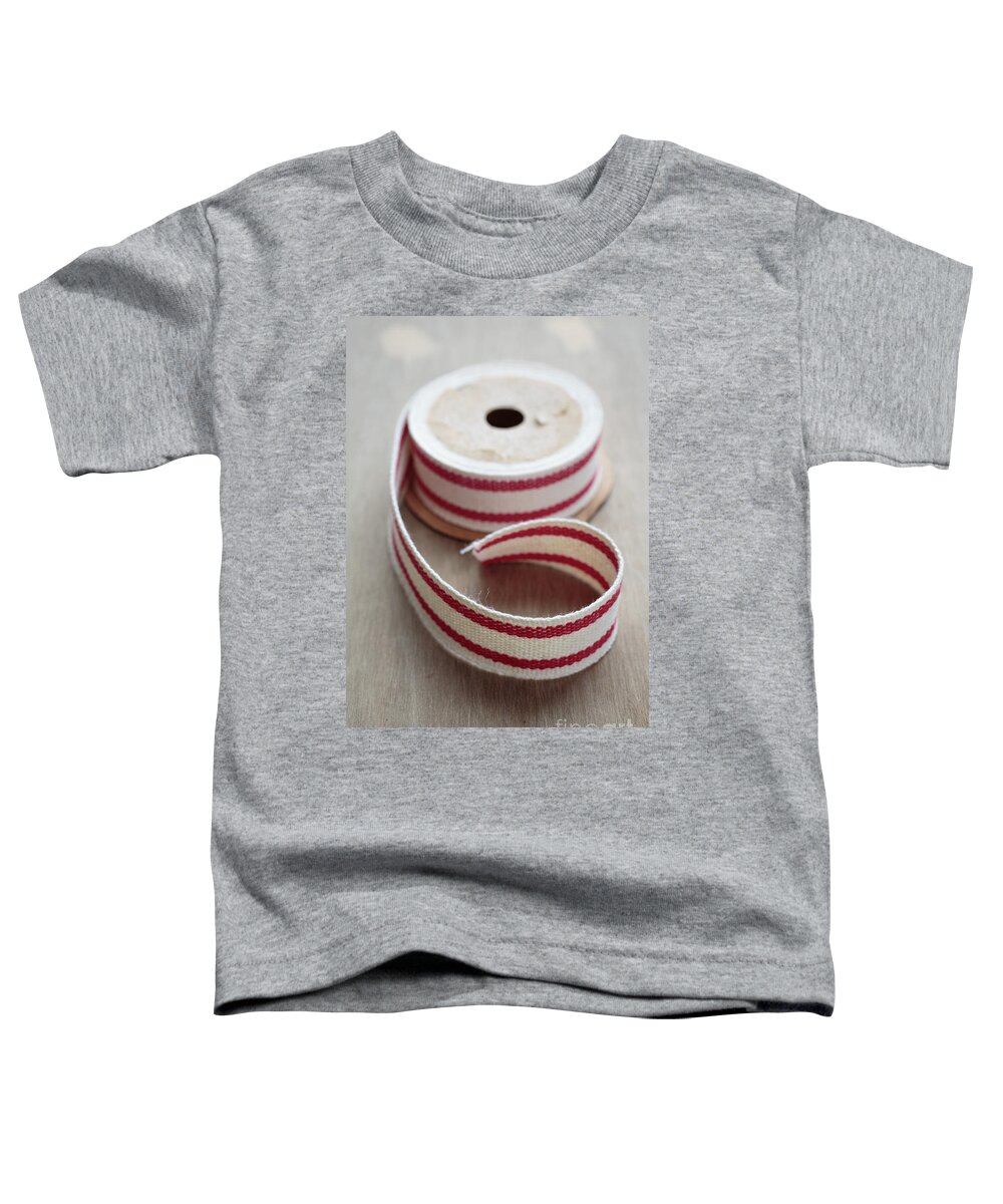 Packing Toddler T-Shirt featuring the photograph Red and White Ribbon Spool by Edward Fielding