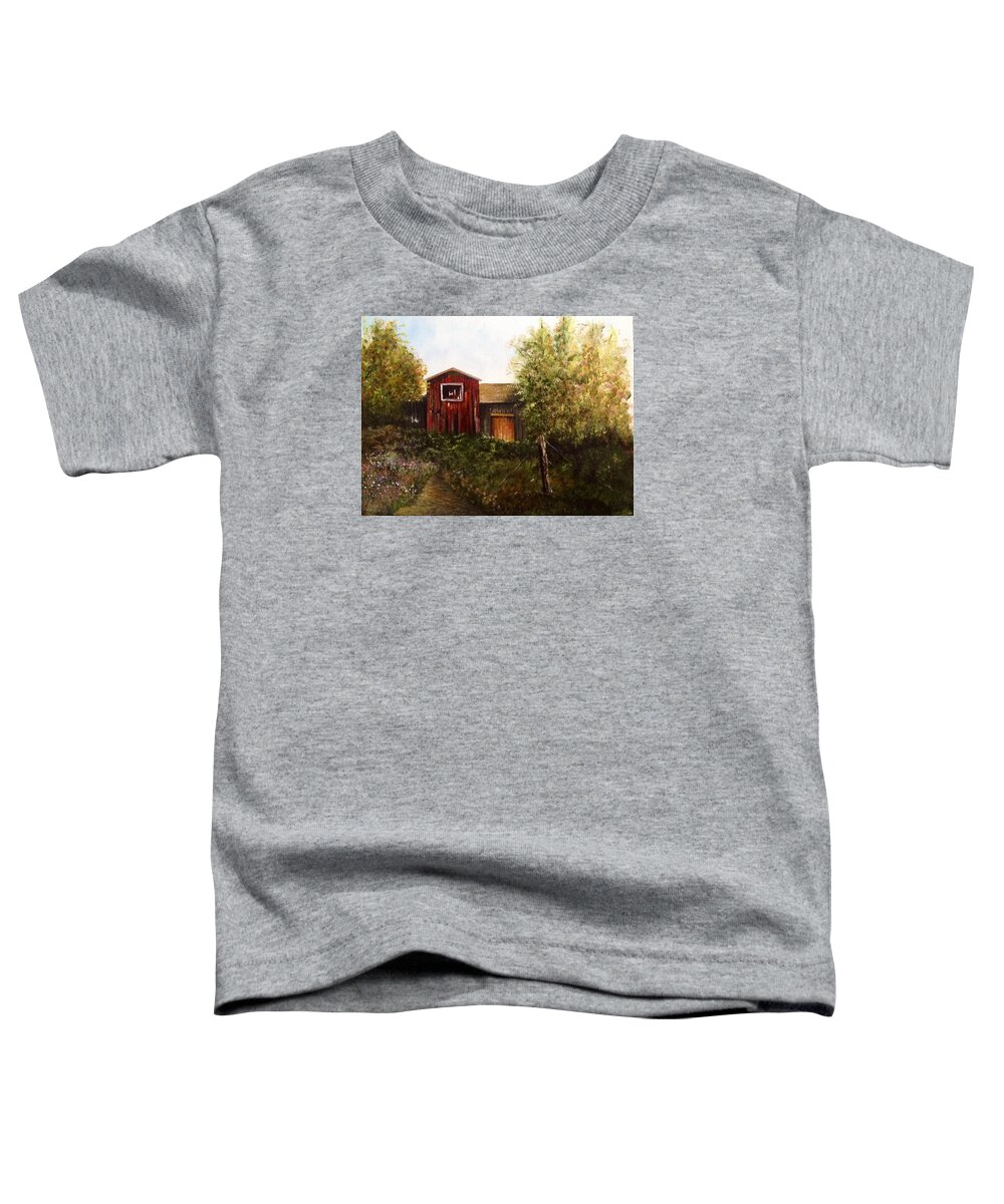 An Old Red Barn With Trees And A Field Of Flowers. There Is A Dirt Pathway Leading To The Front Of The Barn. The Pathway Is Overgrown With Lush Greenery. There Is An Old Fence Post With Wire In The Foreground. Toddler T-Shirt featuring the painting Red Barn by Martin Schmidt