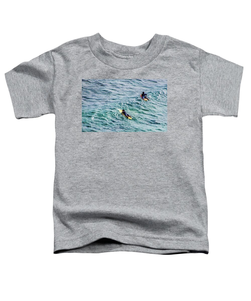 Surfers In The Pacific Ocean Toddler T-Shirt featuring the photograph Surfers by Jera Sky