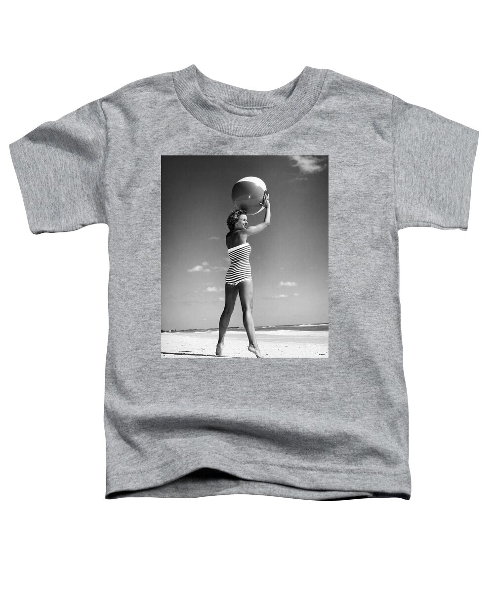 1960s Toddler T-Shirt featuring the photograph Woman With Beach Ball, C.1960s by H Armstrong Roberts and ClassicStock