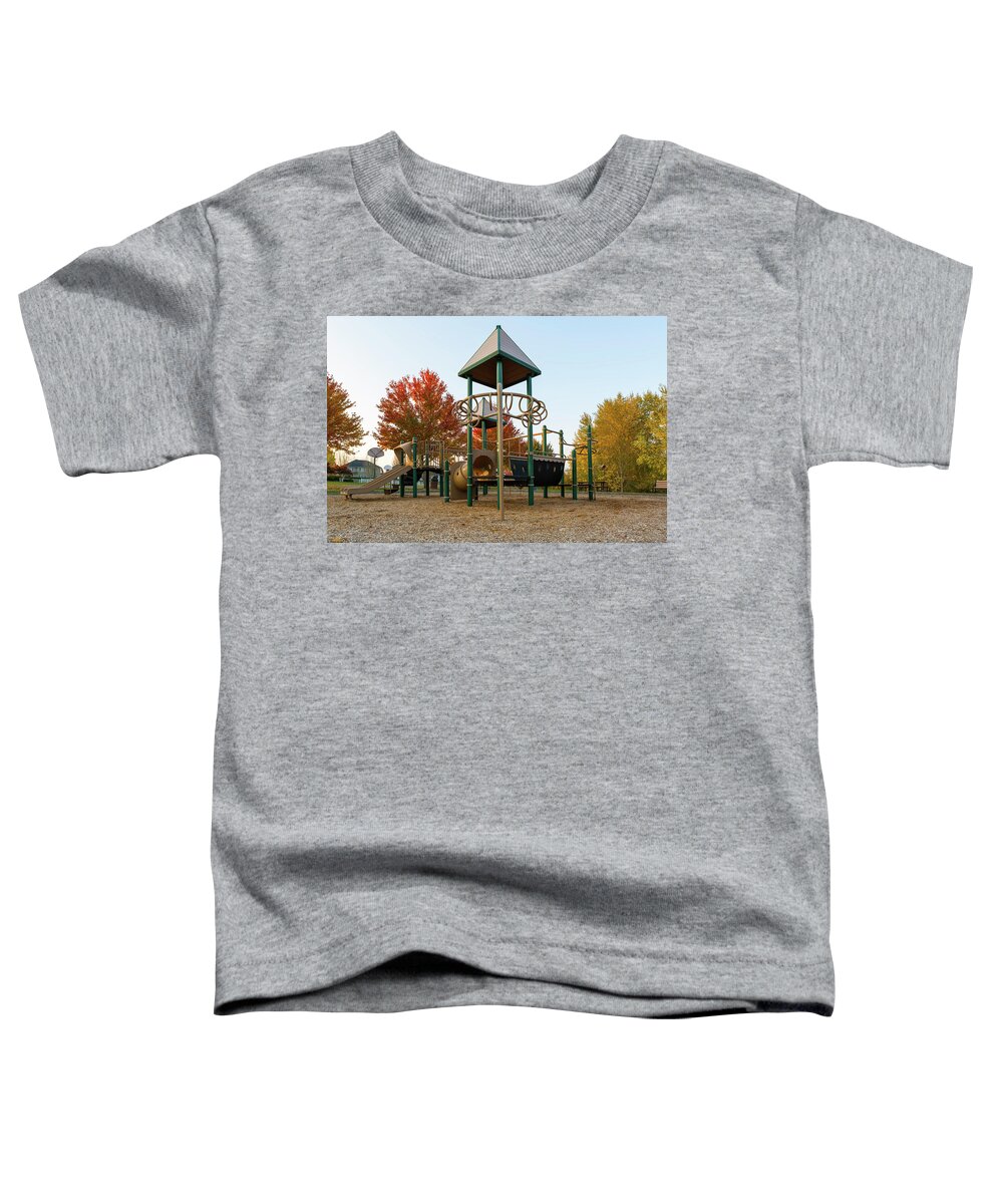 Children Toddler T-Shirt featuring the photograph Children Playground in Neighborhood Park in Fall Season by David Gn