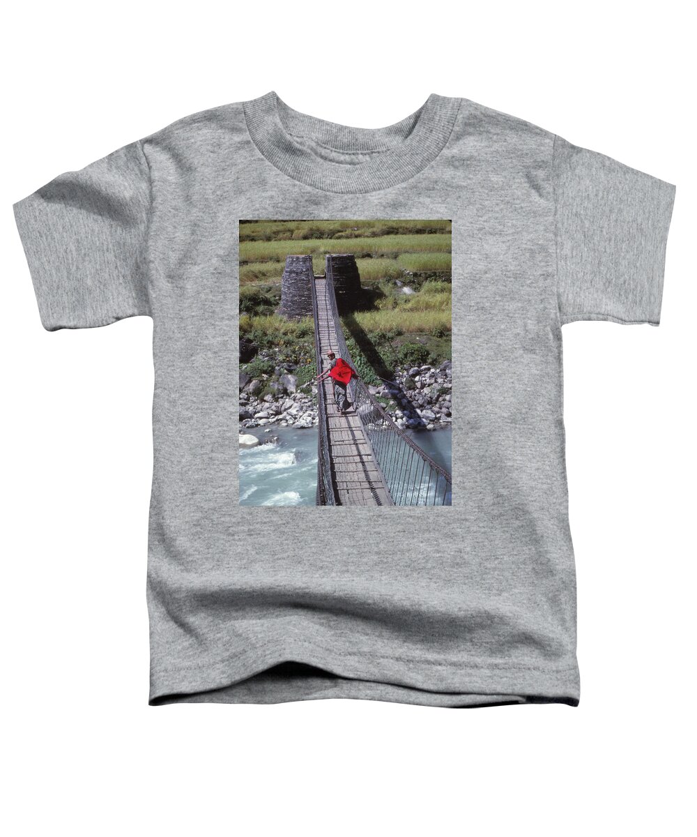 Nepal Toddler T-Shirt featuring the photograph Crossing a suspension bridge by Steve Estvanik