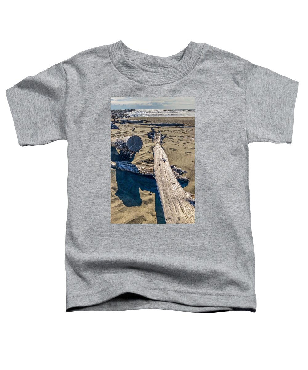 Beach Toddler T-Shirt featuring the photograph Drift wood on the beach by Tatiana Travelways