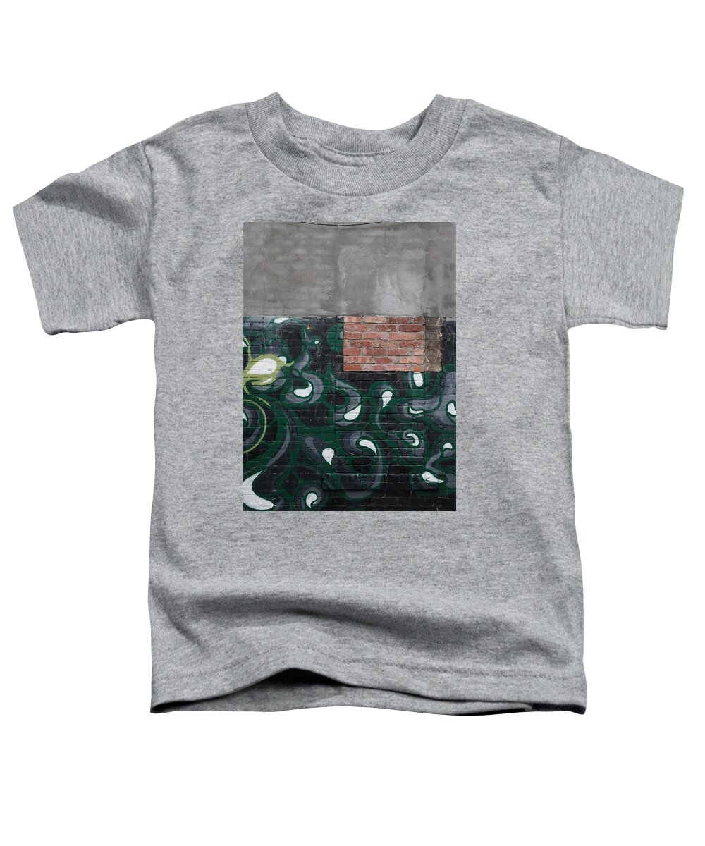 Urban Toddler T-Shirt featuring the photograph Fertilizing The Belligerent by Kreddible Trout