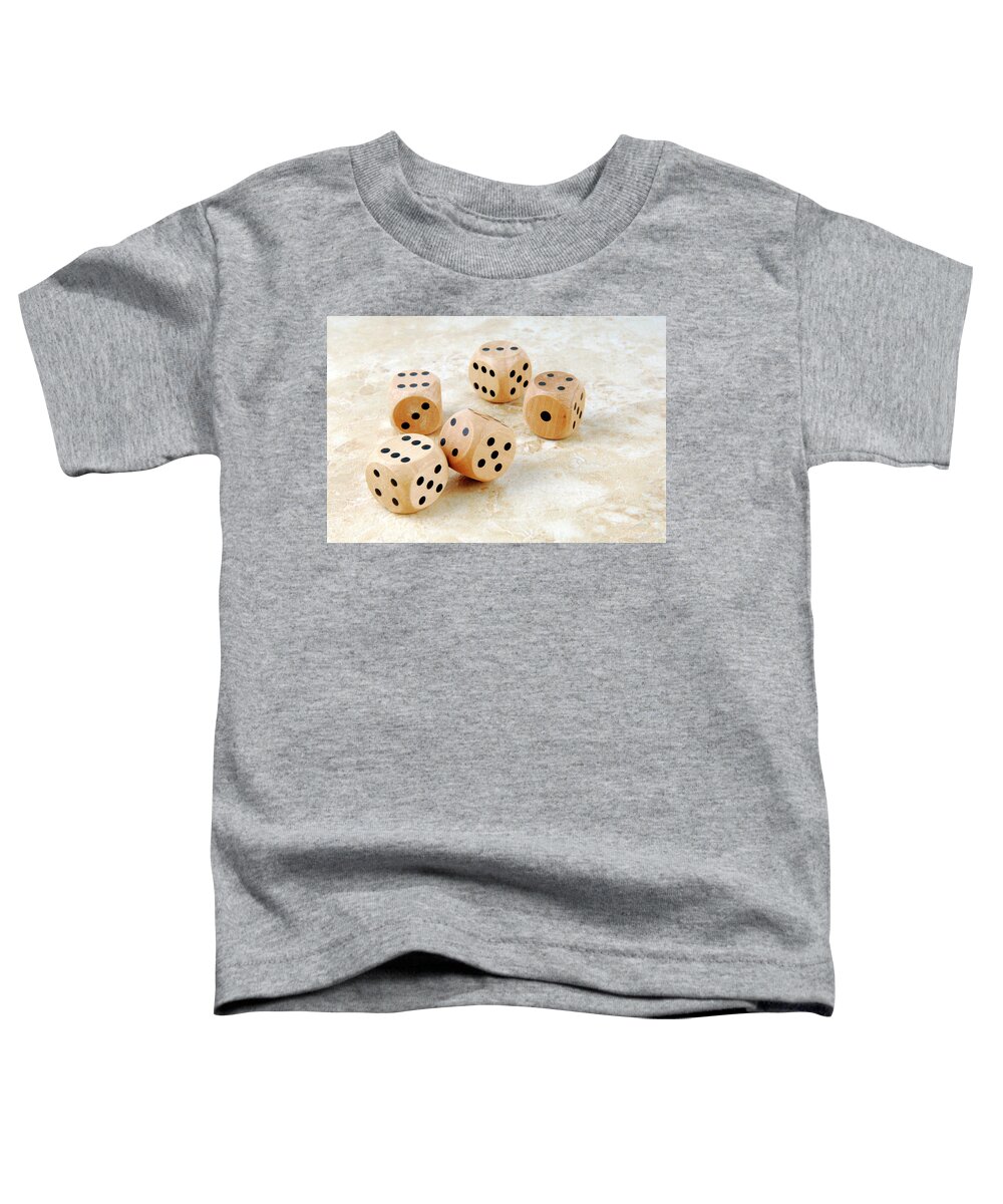 Dice Toddler T-Shirt featuring the photograph Closeup Of The Dices On Marble Stone Table by Severija Kirilovaite