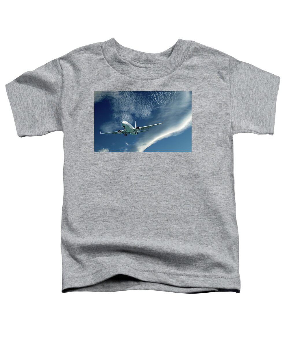 Commercial Aircraft Flying Toddler T-Shirt featuring the photograph Commercial aircraft flying in cloud. by Geoff Childs