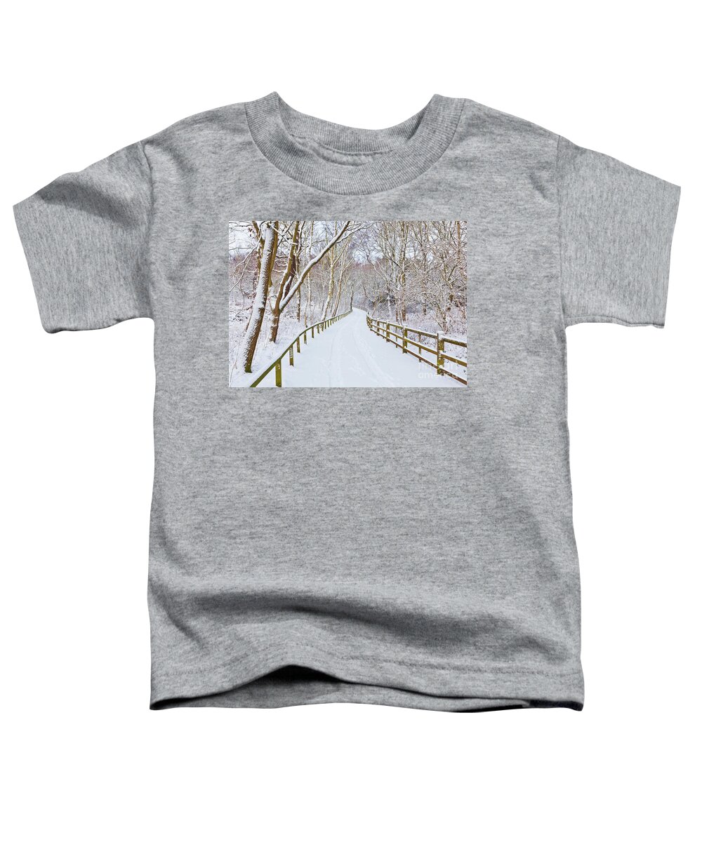 Sherwood Forest Country Park Toddler T-Shirt featuring the photograph Snowy path through trees, Sherwood Forest, Nottingham, England by Neale And Judith Clark