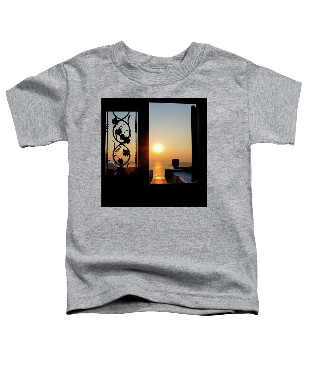 Nightfall Toddler T-Shirt featuring the photograph Sunset in the aegean sea from a house. Santorini island Greece. by Michalakis Ppalis