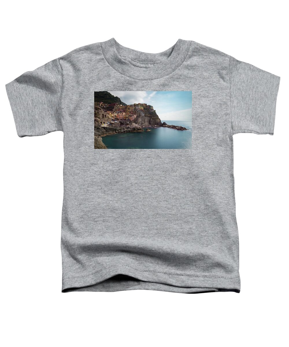 Cinque Terre Toddler T-Shirt featuring the photograph Village of Manarola with colourful houses at the edge of the cliff Riomaggiore, Cinque Terre, Liguria, Italy by Michalakis Ppalis