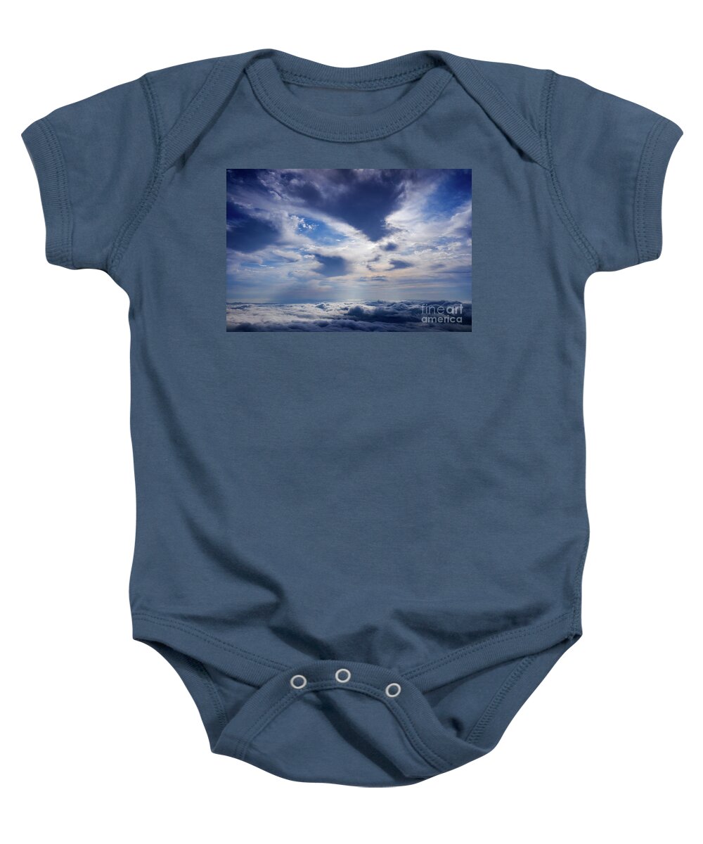 Alps Baby Onesie featuring the photograph Scene of a winter cloudy sky from the top of a mountain peak. #3 by Joaquin Corbalan