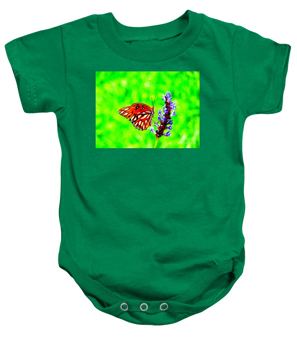 Butterfly Baby Onesie featuring the photograph Orange Butterly Against A Funky Green Background by Renee Trenholm