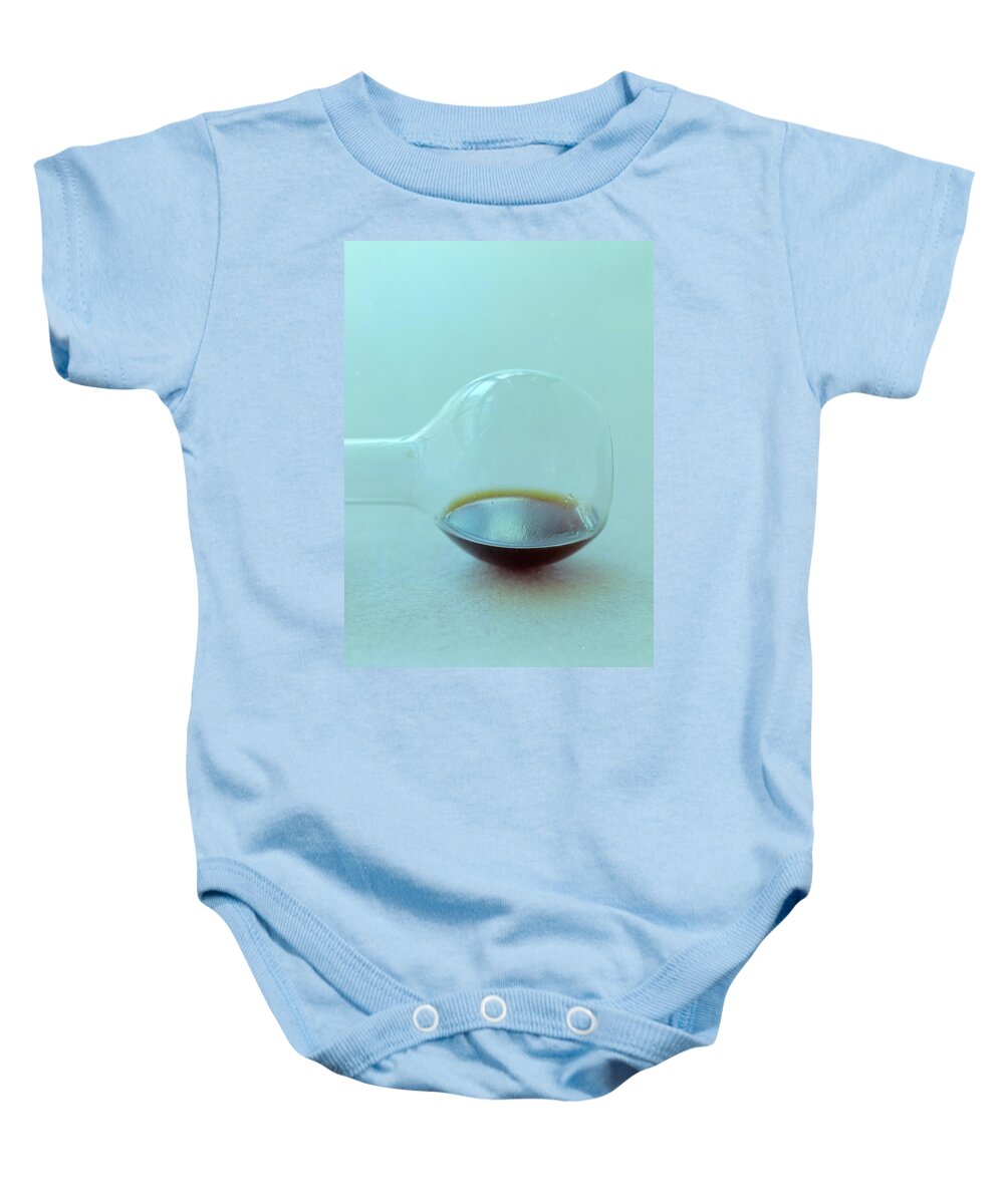 Condiment Baby Onesie featuring the photograph A Beaker With Vinegar by Romulo Yanes