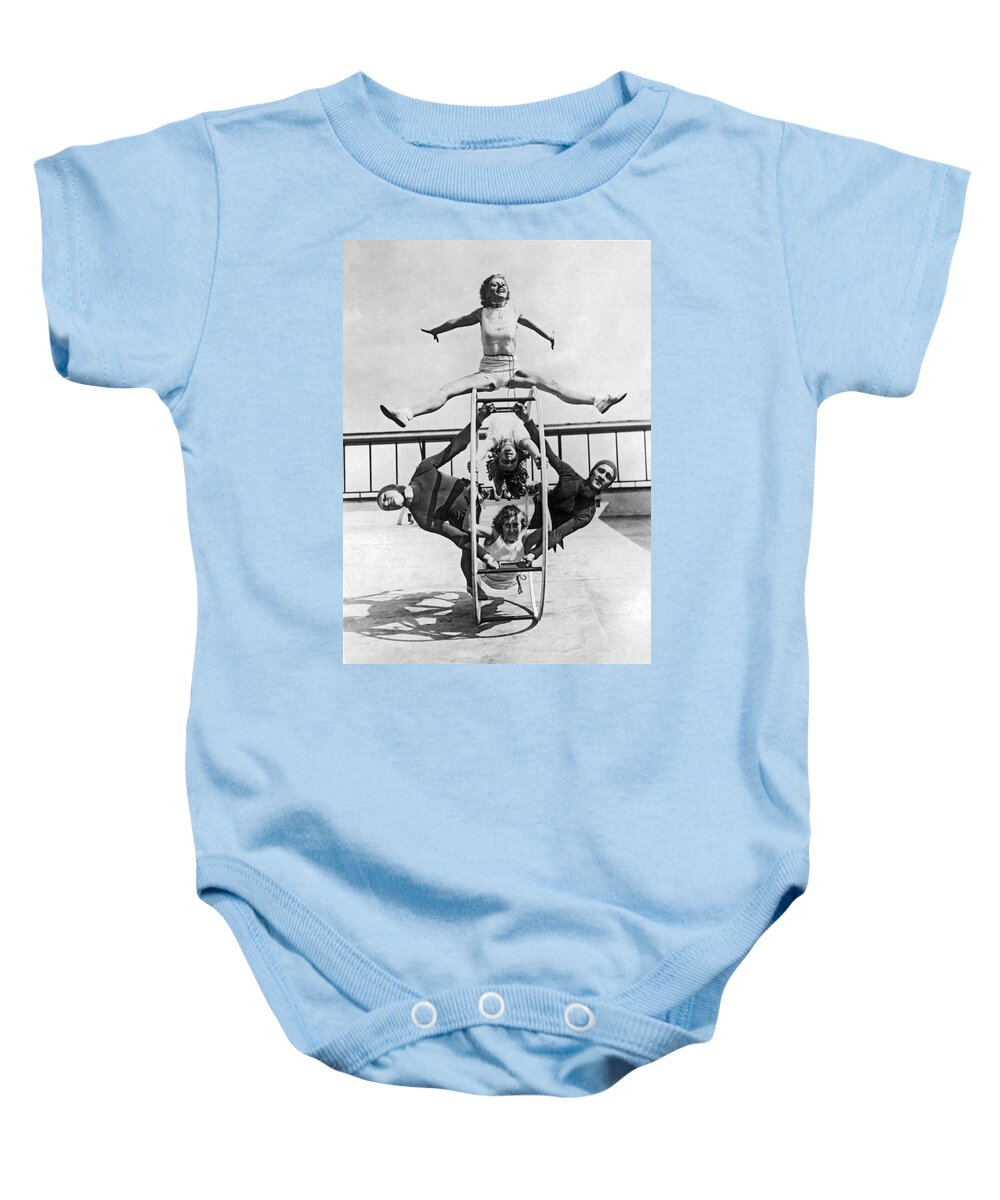 1928 Baby Onesie featuring the photograph A Rhoen Wheel Demonstration by Underwood Archives