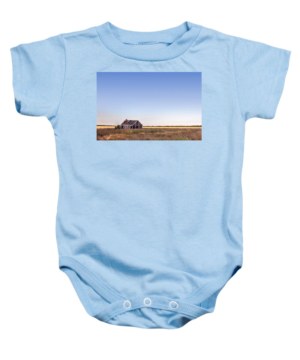 Barn Baby Onesie featuring the photograph Abandoned Farmhouse in a Field by Todd Aaron