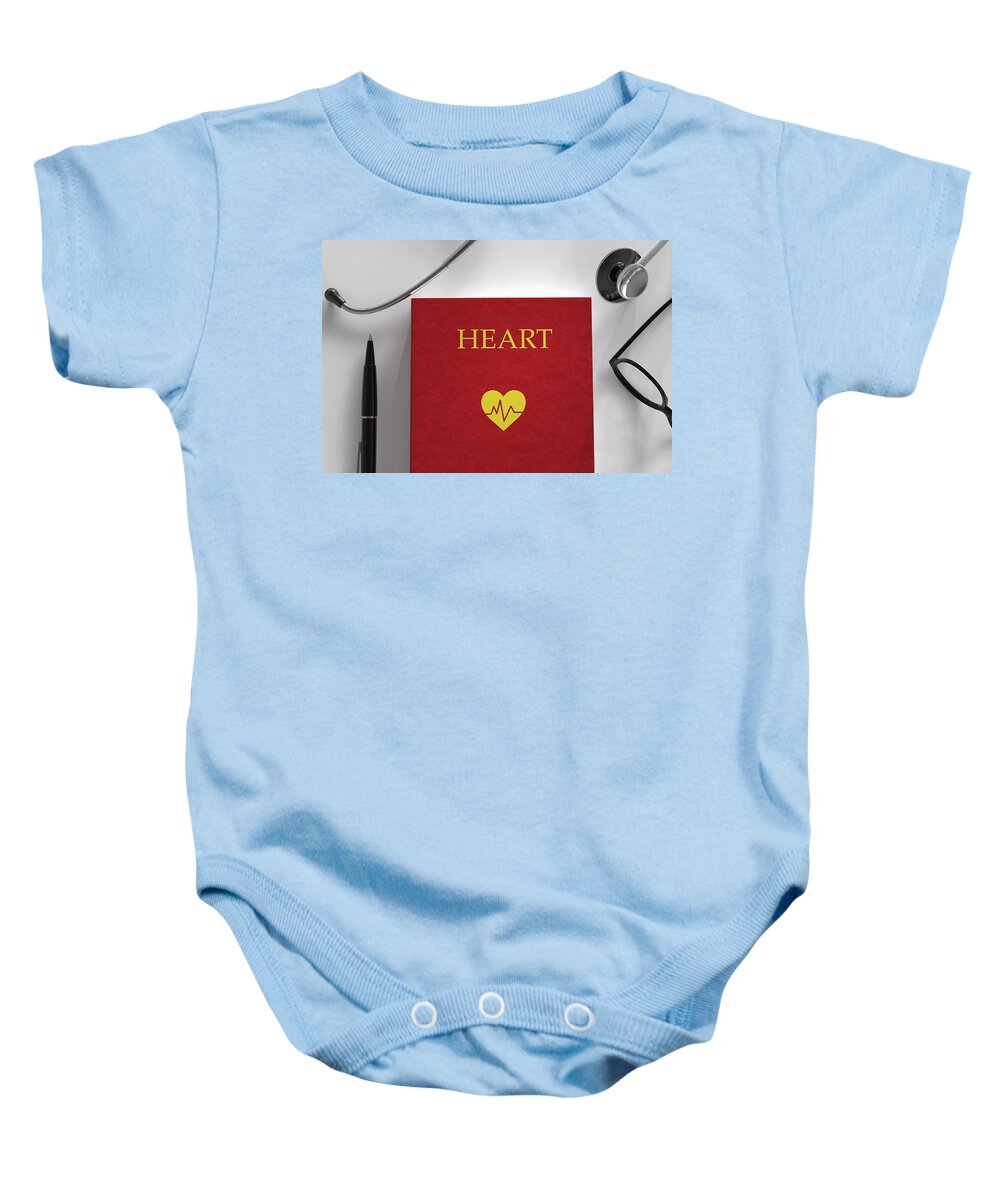 Book Baby Onesie featuring the photograph Medical Book About The Heart by Ikon Images