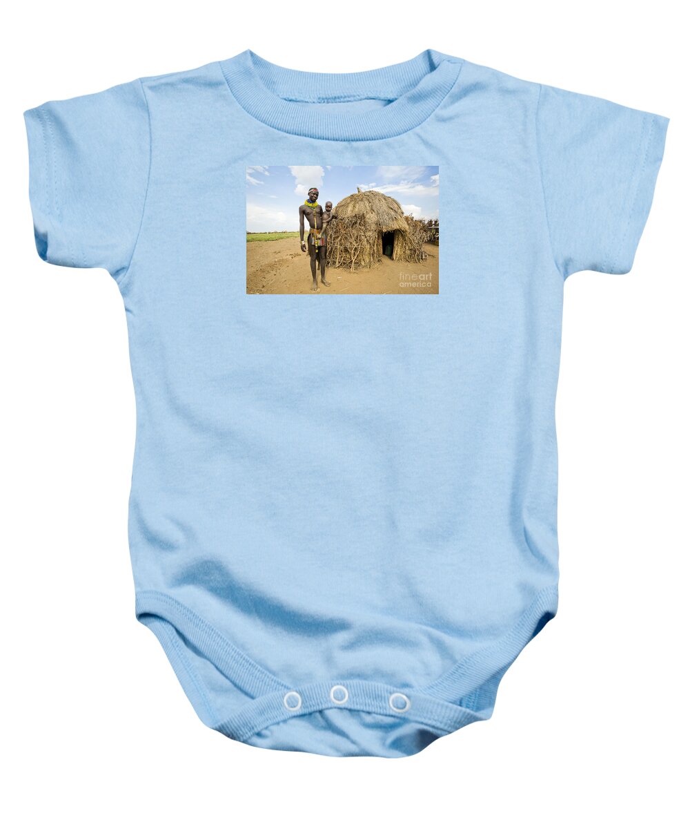 Nyangatom Baby Onesie featuring the photograph Nyangatom woman with baby in arms #1 by Eyal Bartov